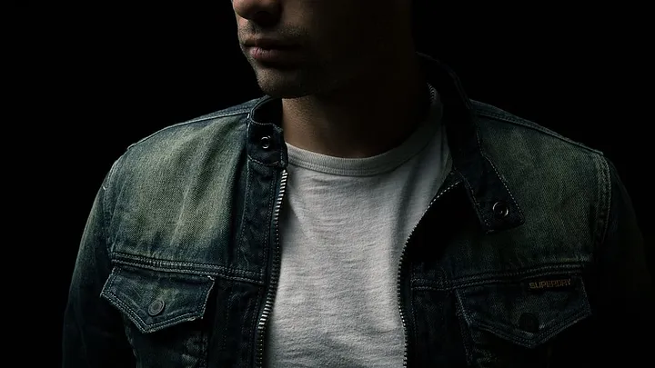 person in denim jacket and T-shirt