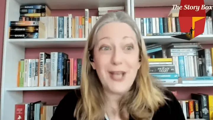 Helen Joyce in front of bookshelf