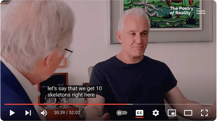 Peter Boghossian telling Richard Dawkins: 'lets say that we get 10 skeletons right here' (video still with closed caption)