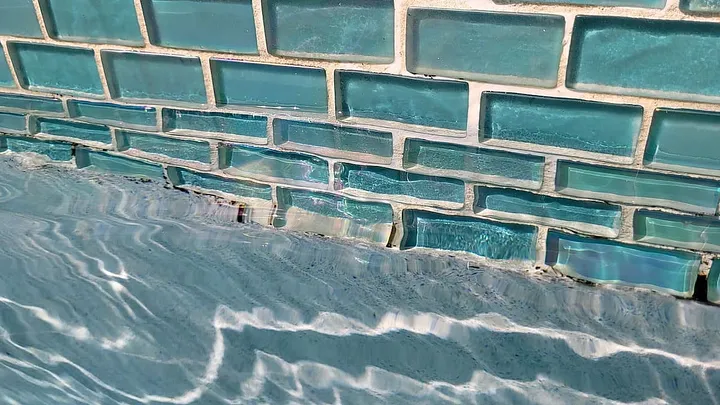 blue glass brick wall in swimming pool