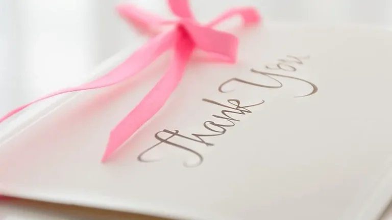 'thank you' stationery with a pink ribbon