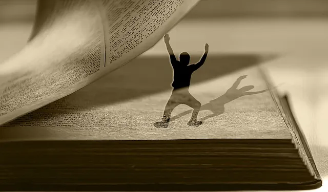 see-through cut-out human figure standing inside the pages of a book, turning the page