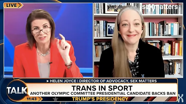 split-screen of Julia Hartley-Brewer and Helen Joyce as talking heads on TalkTV. Hartley-Brewer wears a red jacket and lifts her index finger to make a point. Joyce wears a black shirt and smiles.