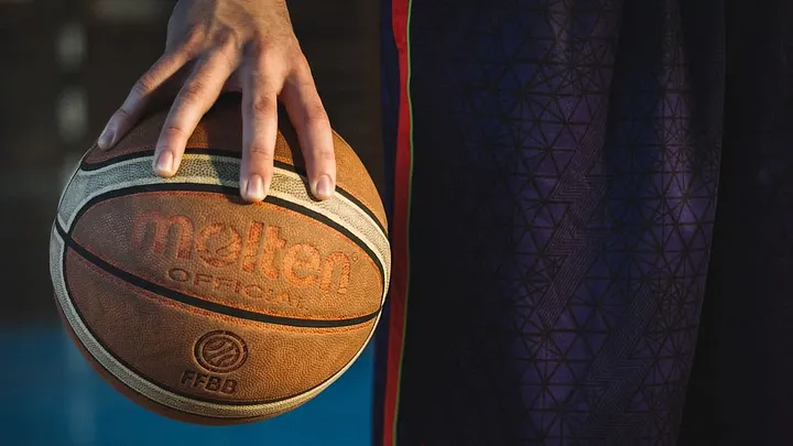 closeup of person holding a basketball