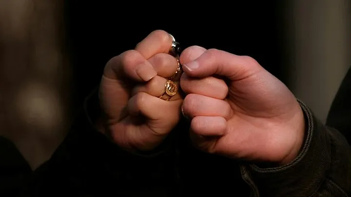 two people bump fists